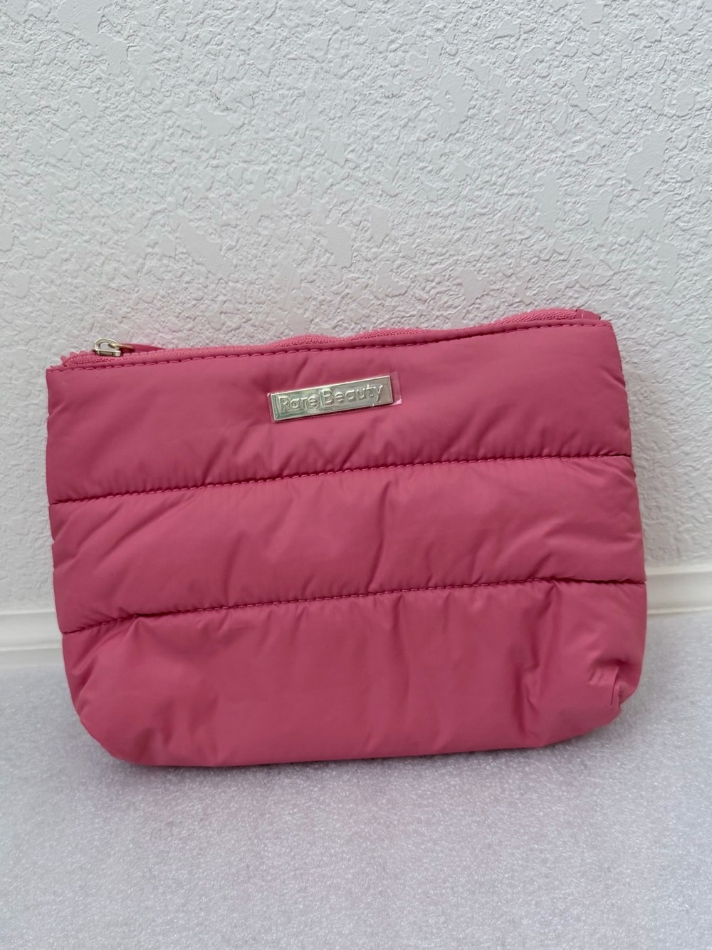 Rare Beauty Puffy Makeup Bag in the shade Happy